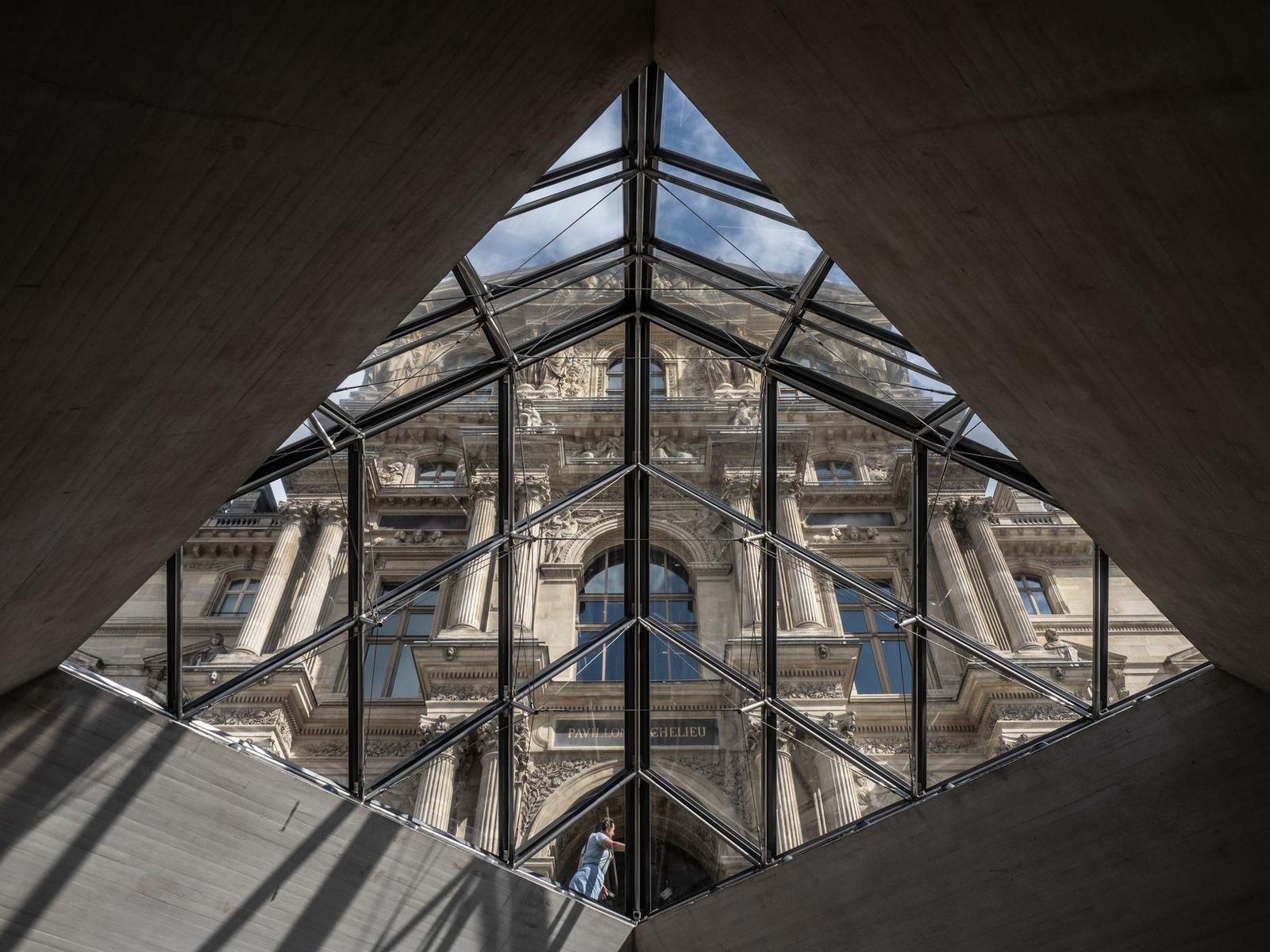 Iconic Louvre Pyramid Glass Structure in Paris
